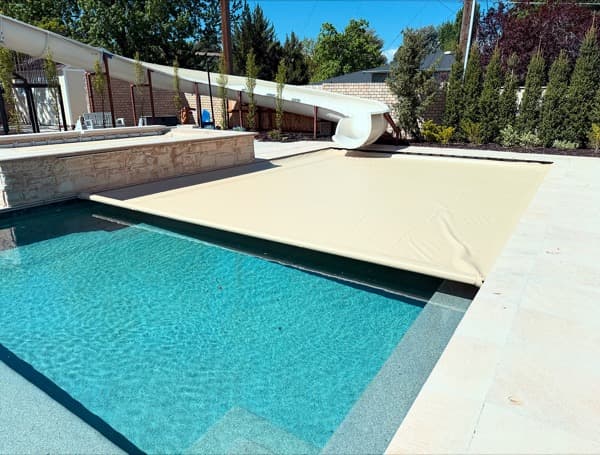 Pool cover with slide